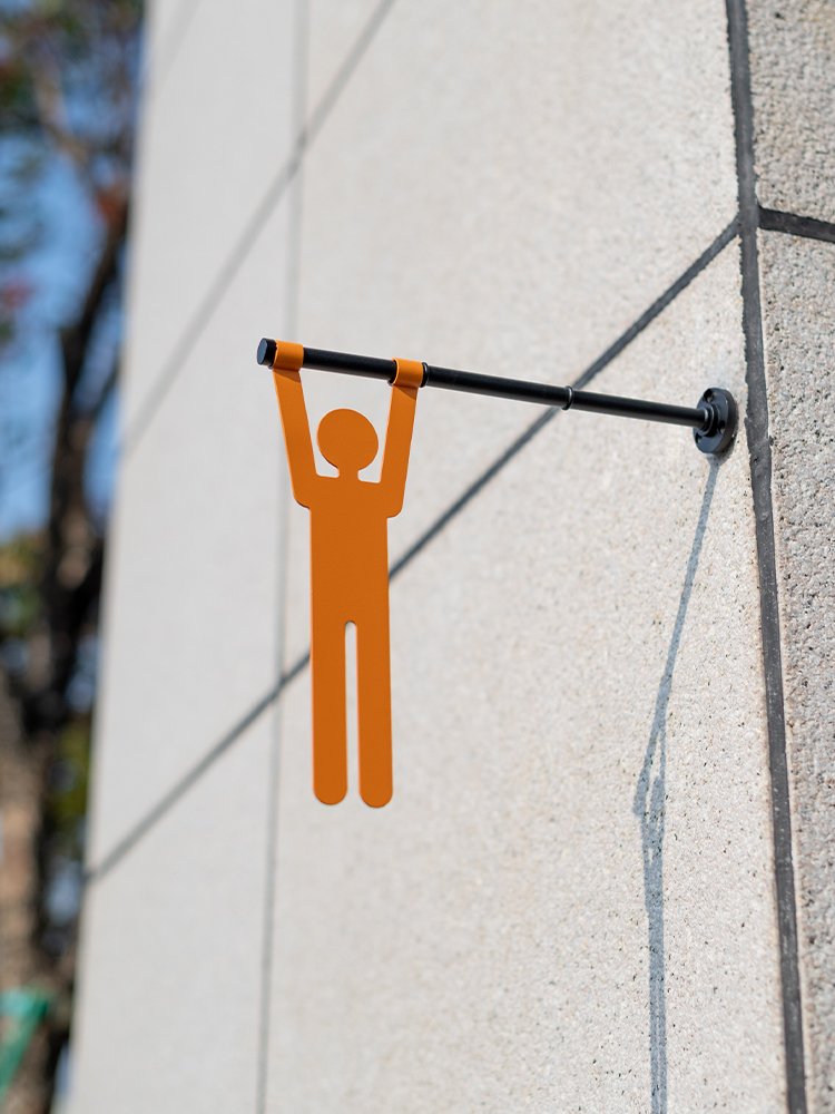Single male silhouette on the projecting restroom sign rod